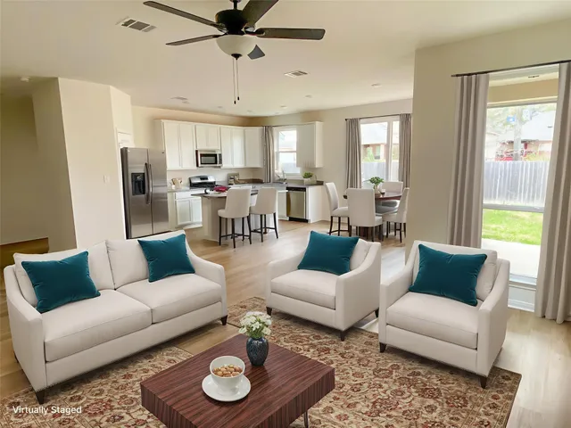 a living room with furniture and a window