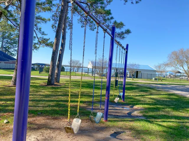 a view of a park with iron fence