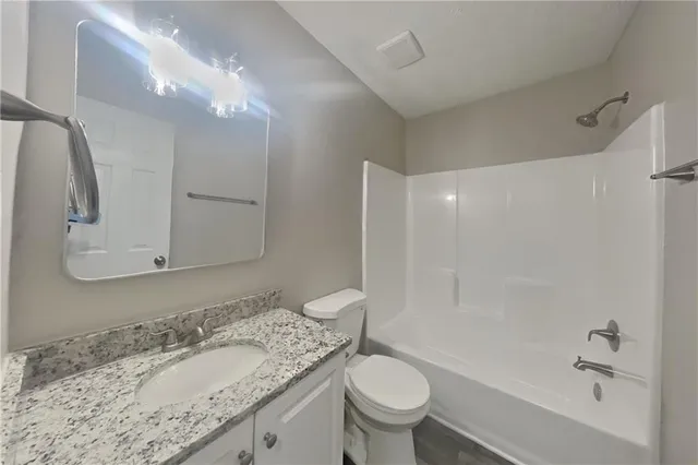 a front view of a house with garage