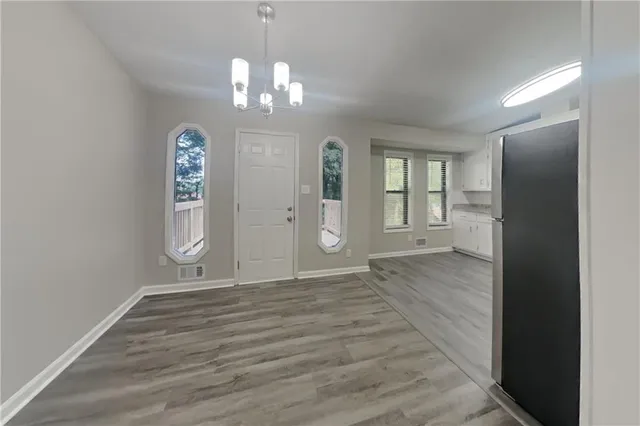 a view of an empty room with a window