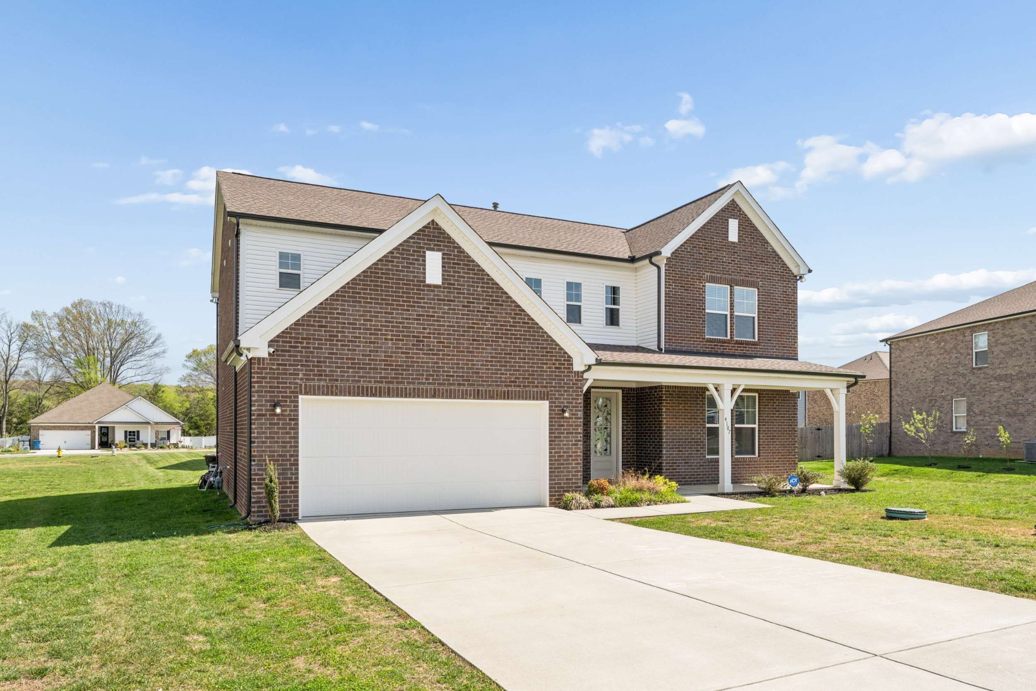 4107 Dwight Way Murfreesboro, TN 37128 - Photo 2 of 41 a front view of a house with a yard and garage