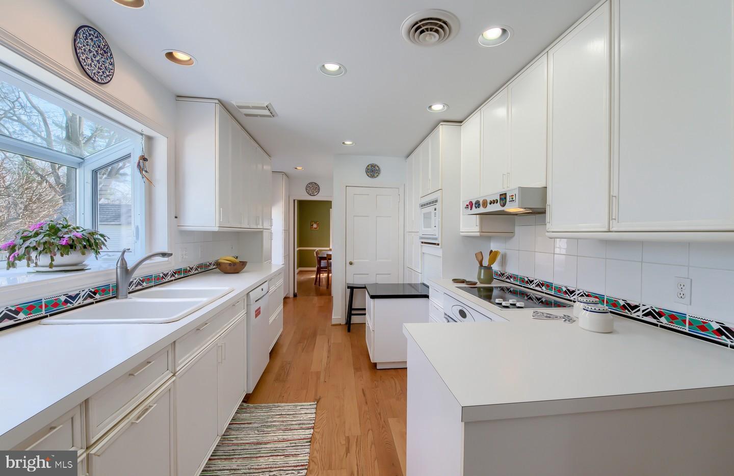 222 Dallam Road Newark, DE 19711 - Photo 12 of 34 a kitchen with a sink a stove and cabinets