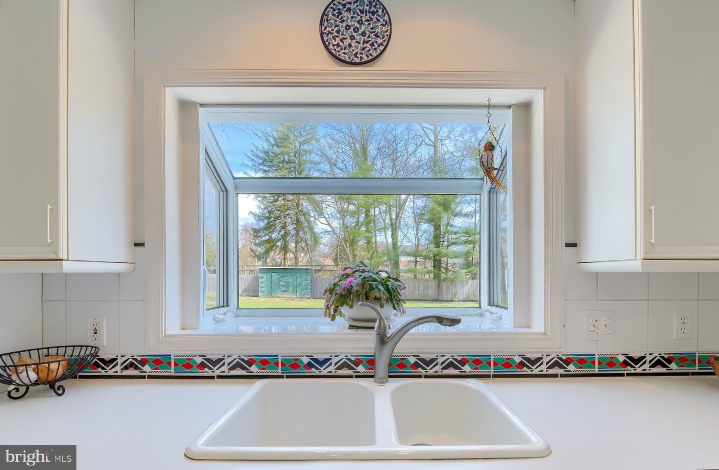 222 Dallam Road Newark, DE 19711 - Photo 13 of 34 a view of a kitchen with kitchen island and a window