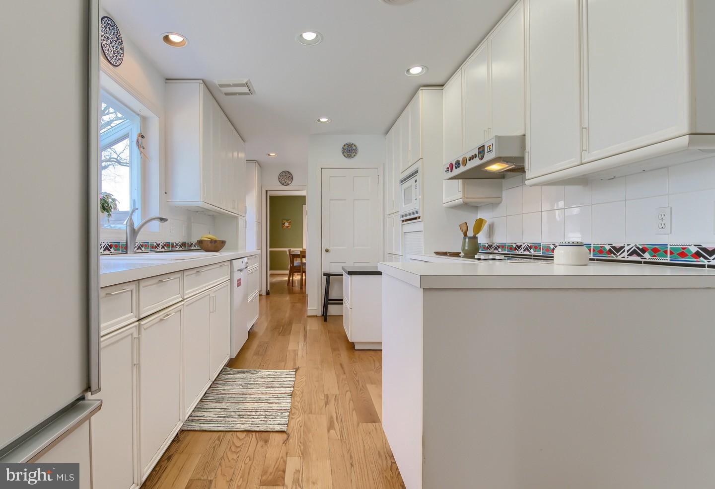 222 Dallam Road Newark, DE 19711 - Photo 14 of 34 a kitchen with stainless steel appliances a refrigerator sink and cabinets