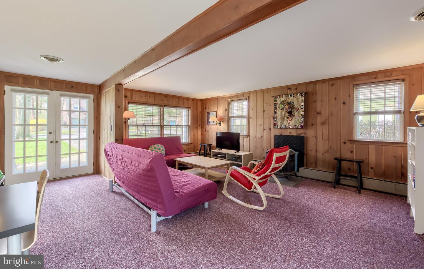 222 Dallam Road Newark, DE 19711 - Photo 16 of 34 a living room with furniture and a floor to ceiling window