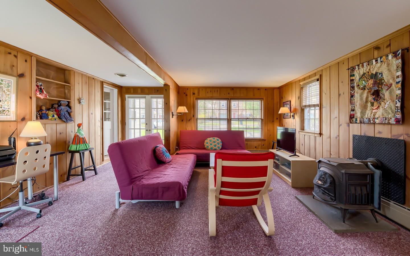 222 Dallam Road Newark, DE 19711 - Photo 18 of 34 a living room with furniture a flat screen tv and large windows