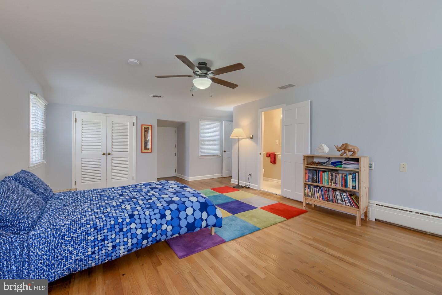 222 Dallam Road Newark, DE 19711 - Photo 30 of 34 a bedroom with wooden floor and a bed