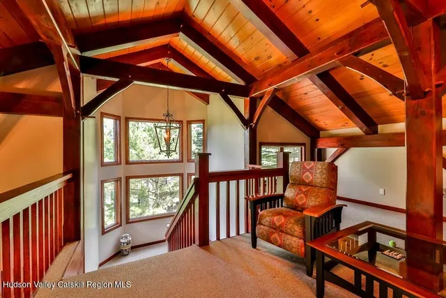a bedroom with furniture and a window