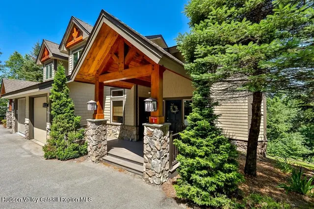 front view of a house with a small yard