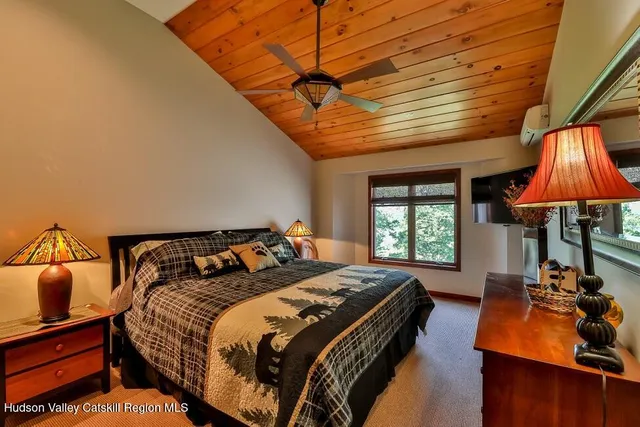 a bed room with a bed and a chandelier