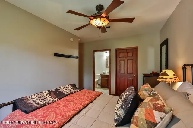 a bedroom with bed and window