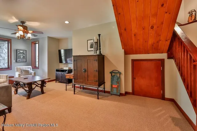 a view of a livingroom with furniture and a flat screen tv
