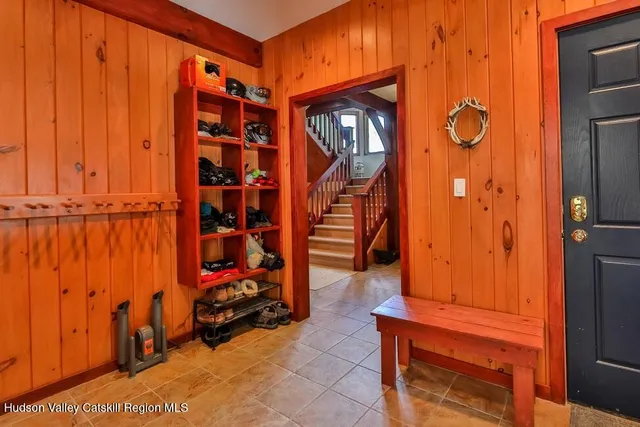 a view of an entryway with wooden door