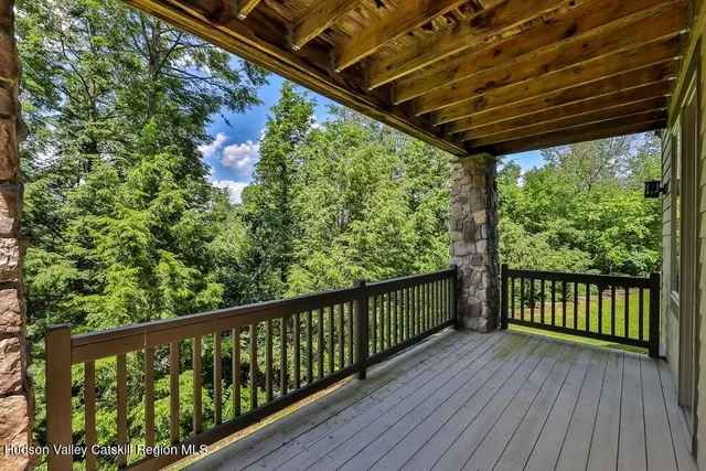 a view of a balcony with wooden floor