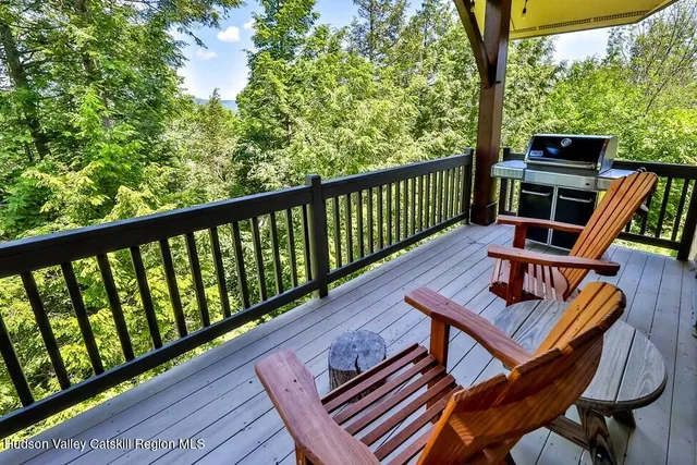 a view of a two chairs in the balcony