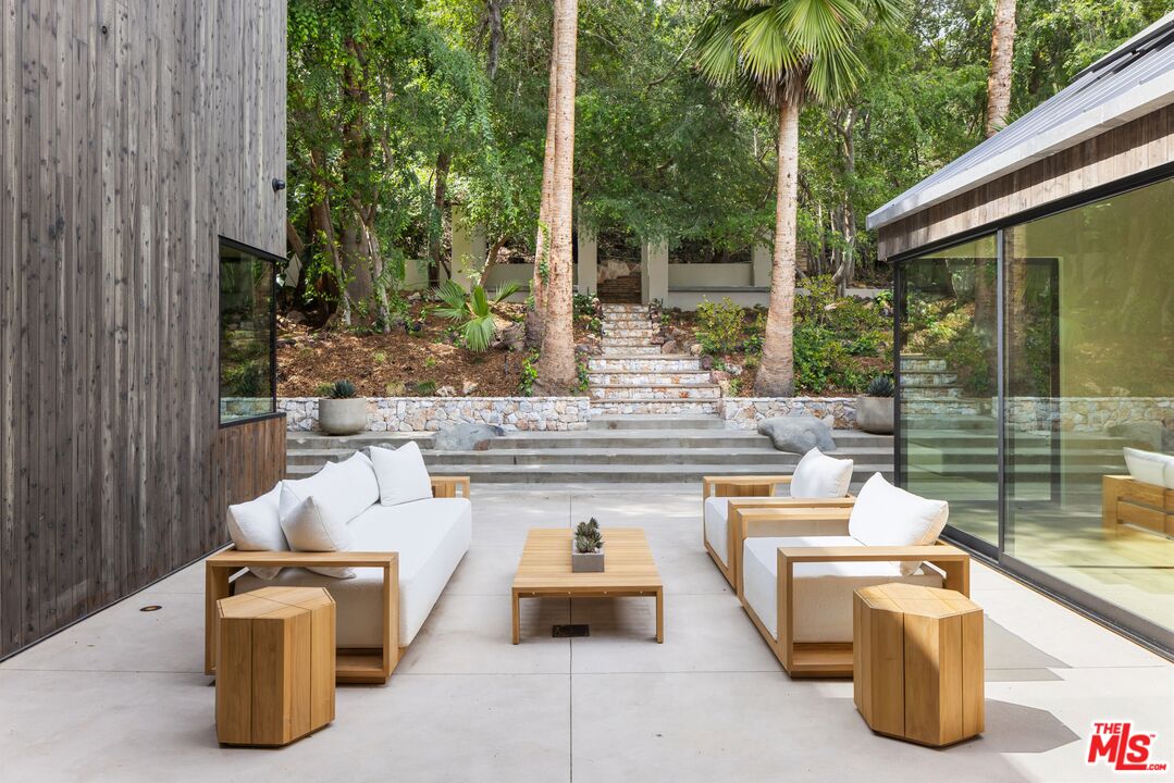 12309 Viewcrest Road Studio City, CA 91604 - Photo 16 of 49 a view of backyard of house with seating space