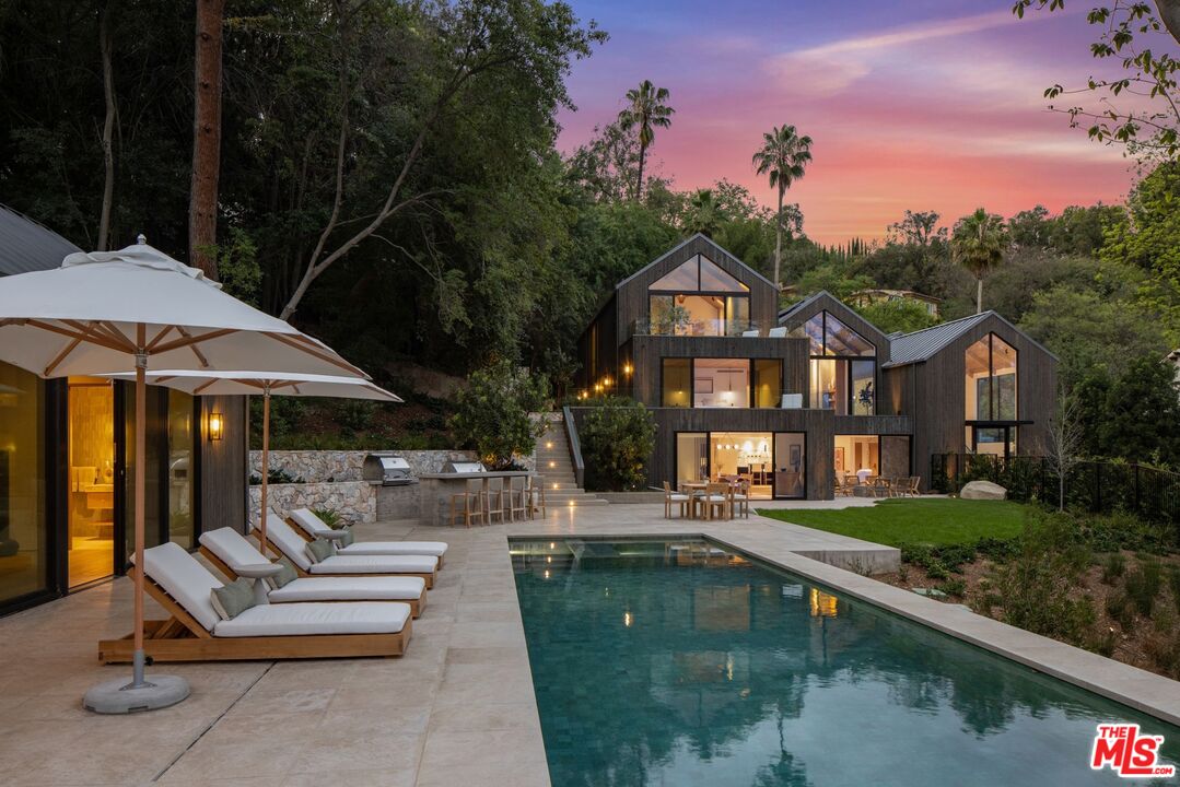 12309 Viewcrest Road Studio City, CA 91604 - Photo 2 of 49 a view of a house with swimming pool and sitting area
