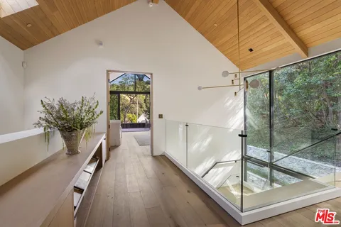 a bedroom with a large bed and furniture