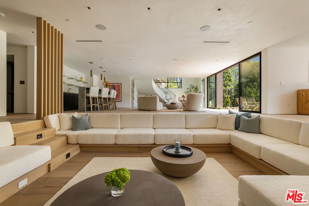 12309 Viewcrest Road Studio City, CA 91604 - Photo 37 of 49 a living room with furniture and a large window