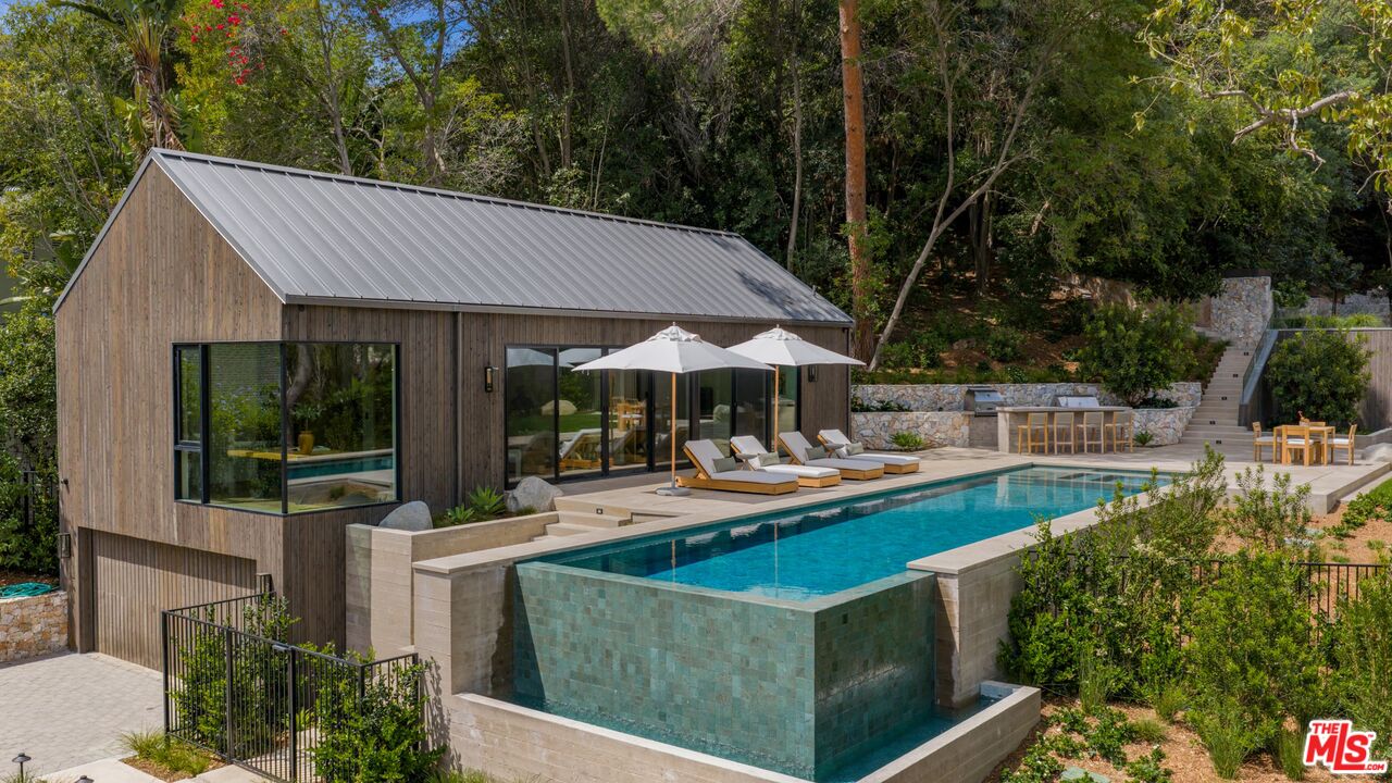 12309 Viewcrest Road Studio City, CA 91604 - Photo 4 of 49 a view of a house with sitting area and garden