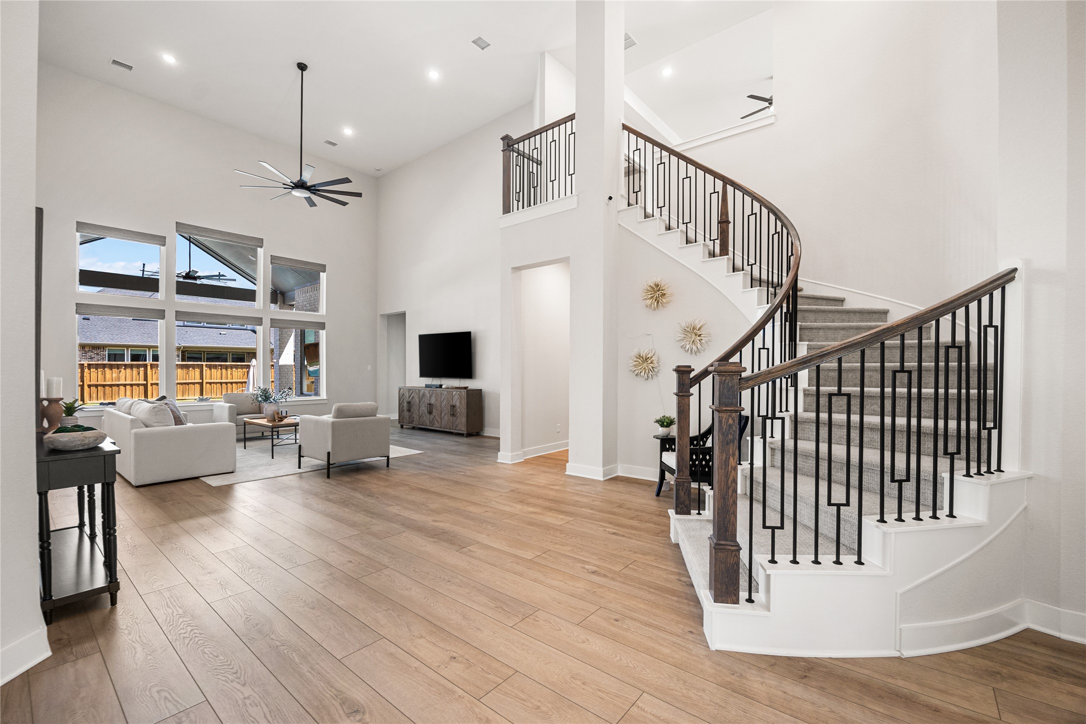 4130 Pleasant Ridge Drive Spring, TX 77386 - Photo 10 of 46 The impressive grand staircase creates a stunning focal point, leading to the second floor with elegance and timeless style.
