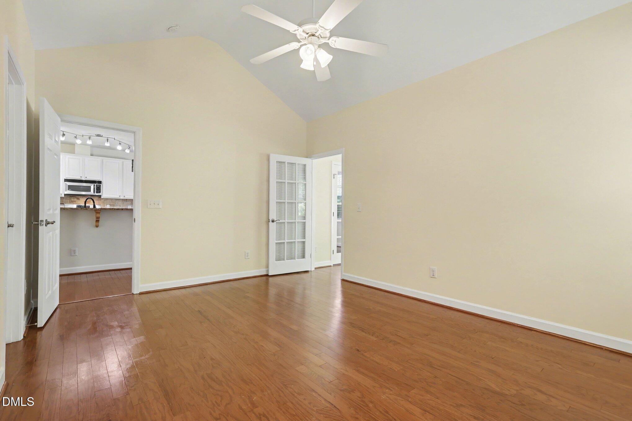 133 Jennel Way Durham, NC 27707 - Photo 14 of 28 an empty room with wooden floor closet and windows