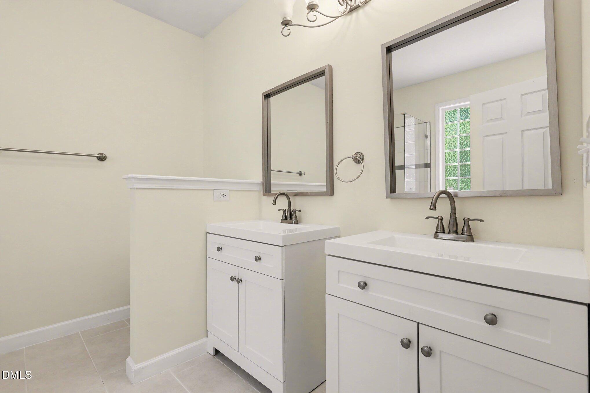 133 Jennel Way Durham, NC 27707 - Photo 15 of 28 a bathroom with a sink and a mirror