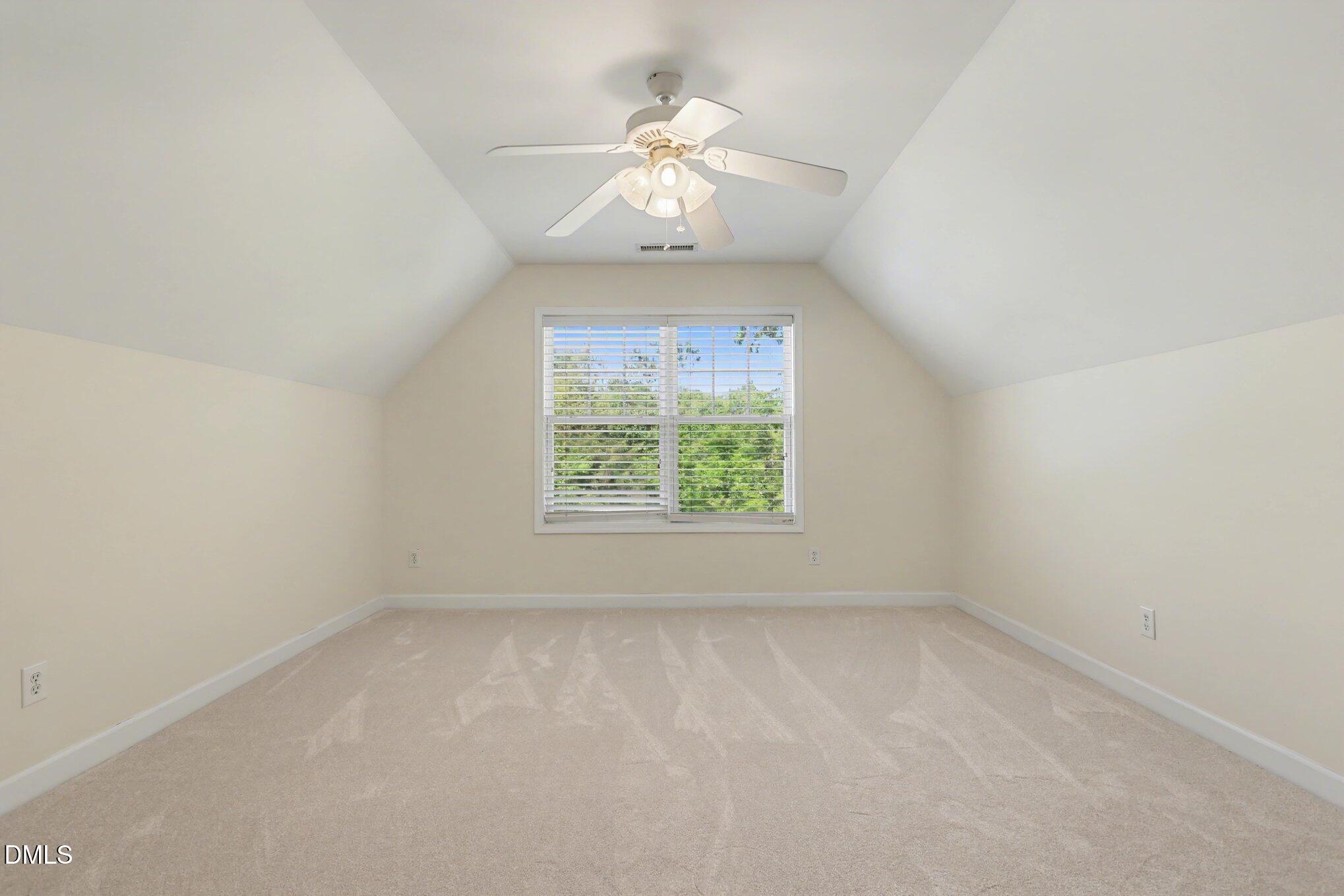 133 Jennel Way Durham, NC 27707 - Photo 22 of 28 an empty room with a window and a fan