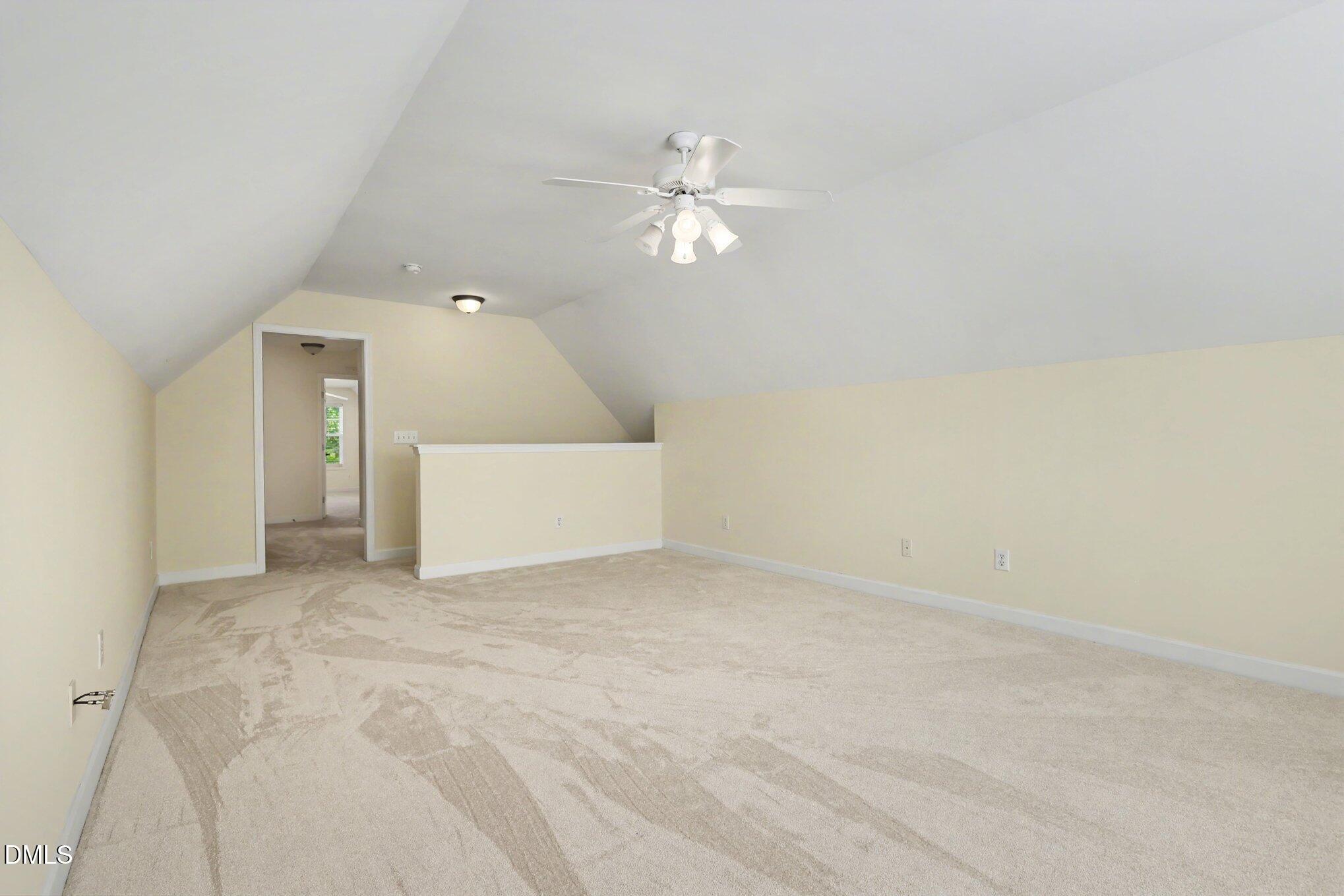 133 Jennel Way Durham, NC 27707 - Photo 23 of 28 an empty room with a ceiling fan and a window