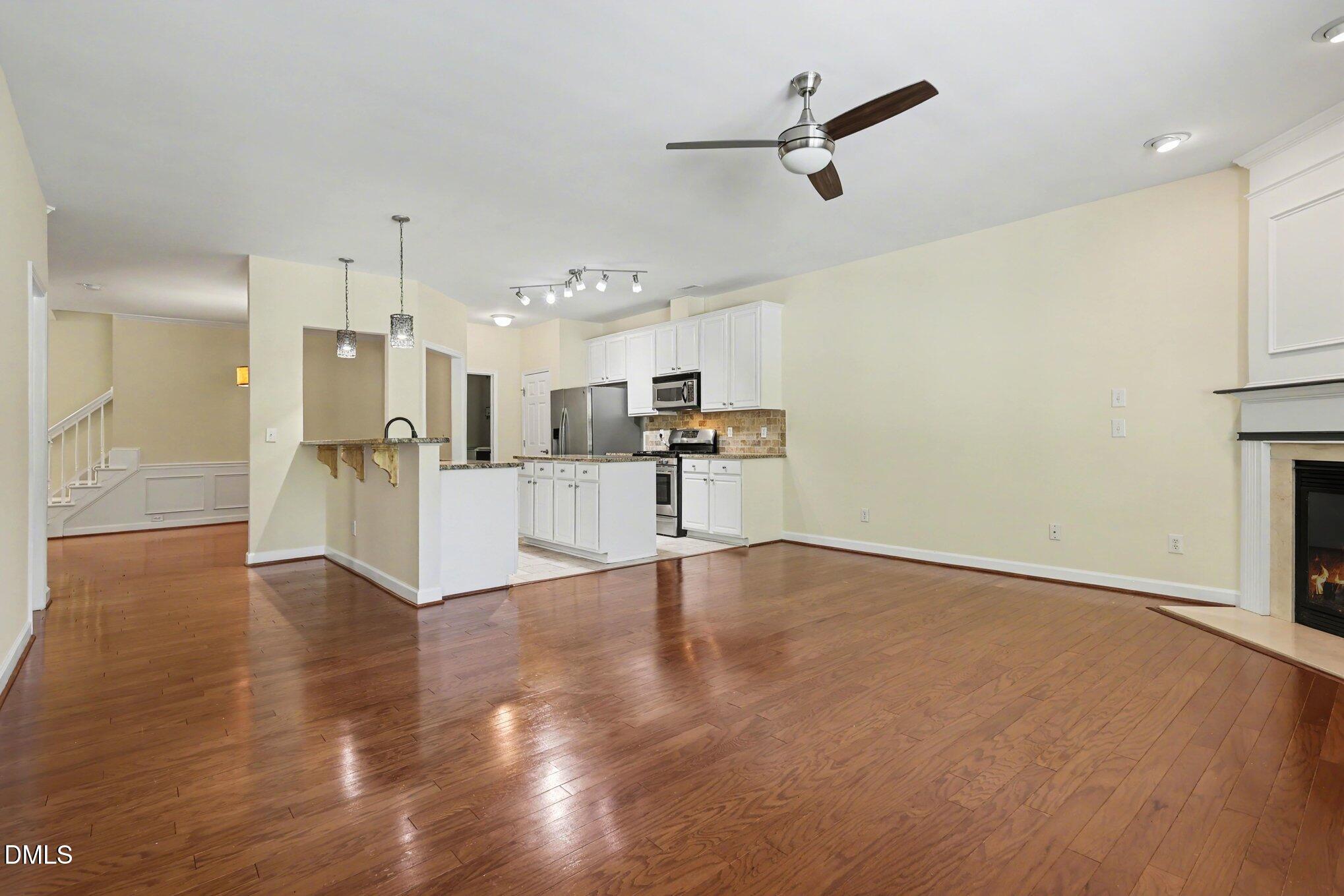 133 Jennel Way Durham, NC 27707 - Photo 5 of 28 a view of a kitchen with a sink and a refrigerator