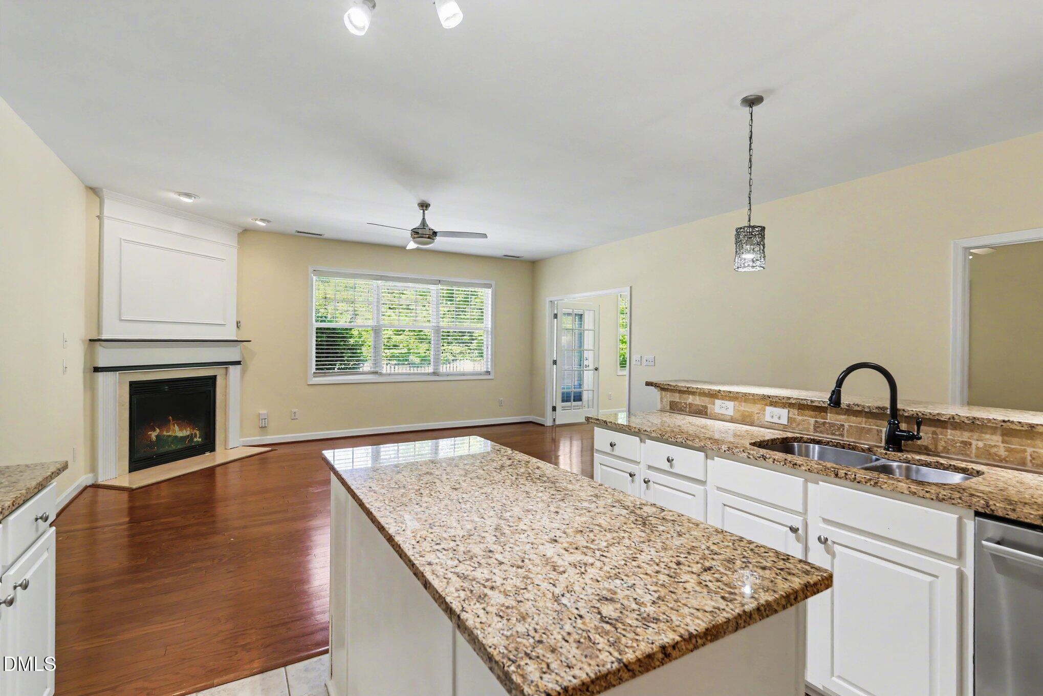 133 Jennel Way Durham, NC 27707 - Photo 6 of 28 a view of a kitchen with a sink and a fireplace