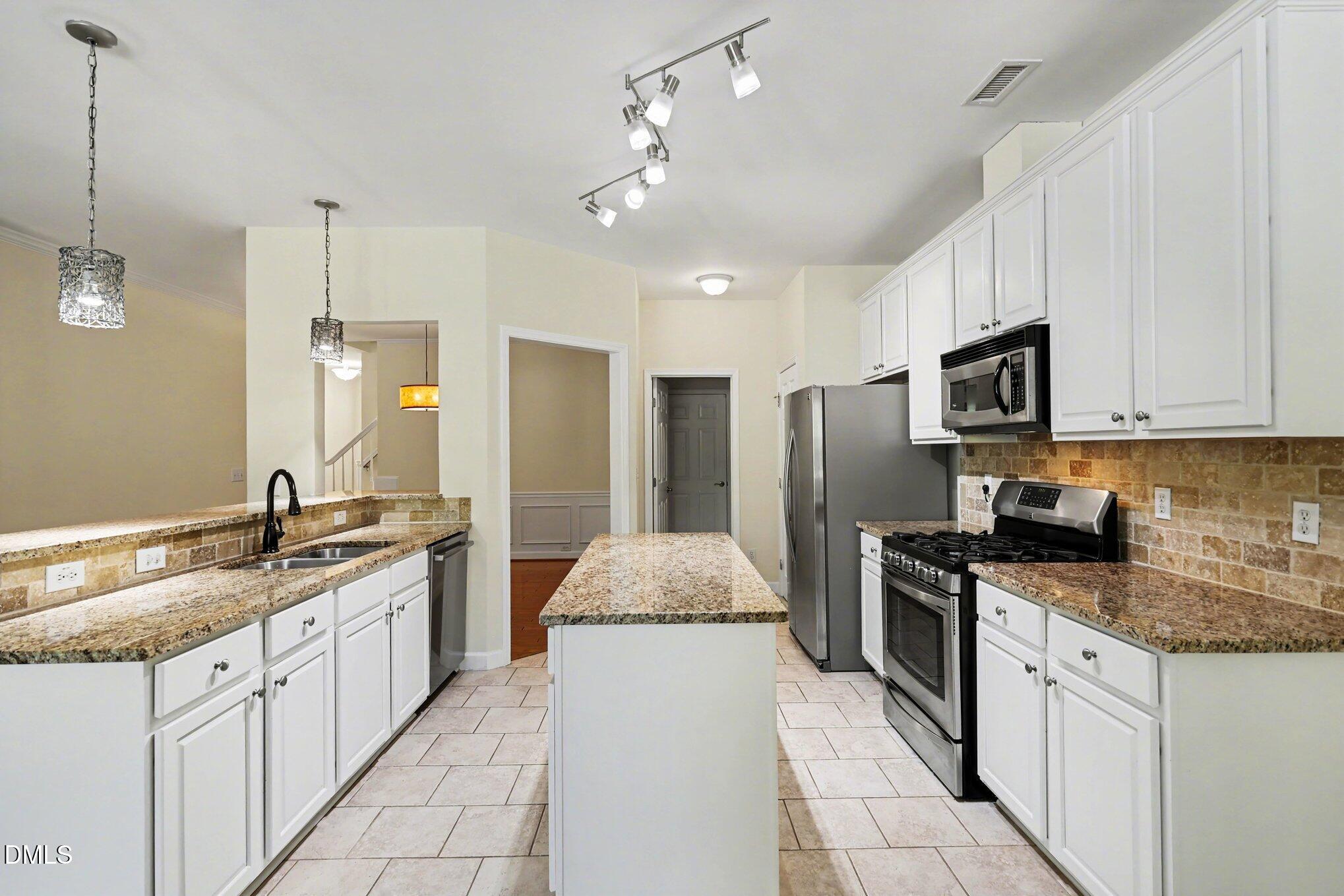133 Jennel Way Durham, NC 27707 - Photo 8 of 28 a kitchen with a sink stove and refrigerator