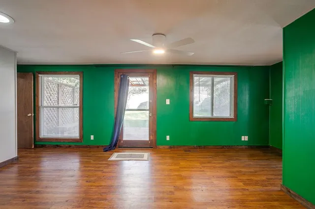 a view of outdoor space and wooden floor
