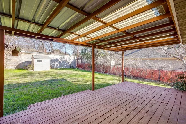 a view of a backyard with wooden floor