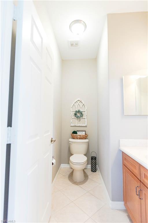 9349 Chestnut Tree Loop Fort Myers, FL 33967 - Photo 15 of 35 a bathroom with a toilet and a sink