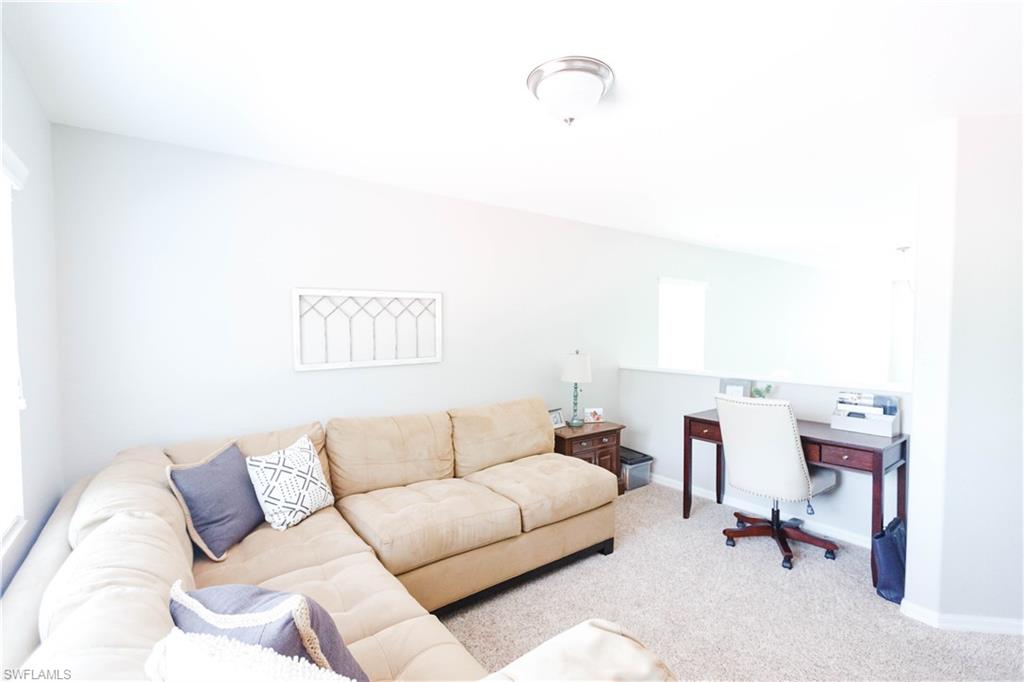 9349 Chestnut Tree Loop Fort Myers, FL 33967 - Photo 18 of 35 a living room with furniture and a couch