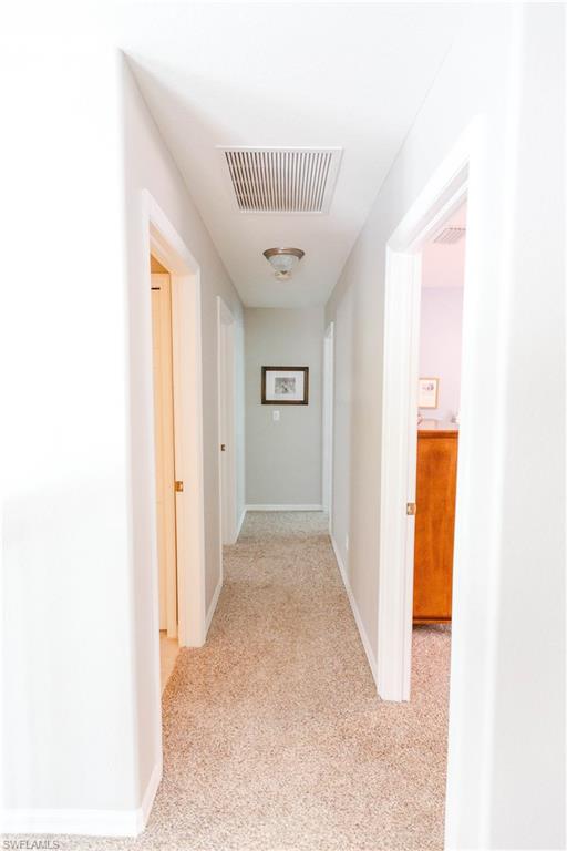 9349 Chestnut Tree Loop Fort Myers, FL 33967 - Photo 23 of 35 a view of a hallway with front door