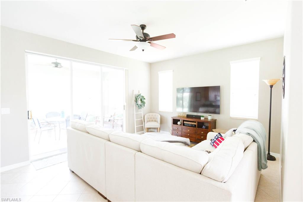 9349 Chestnut Tree Loop Fort Myers, FL 33967 - Photo 7 of 35 a living room with furniture and a flat screen tv