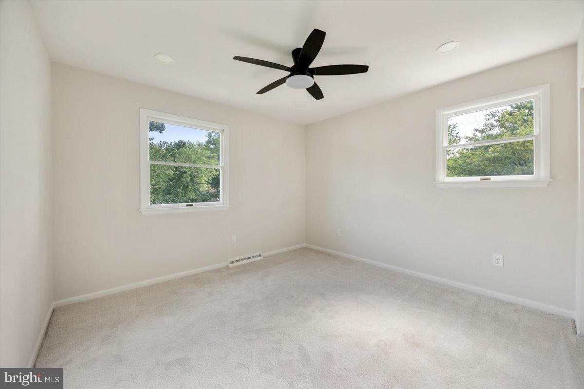 63 Baker Boulevard Marlton, NJ 08053 - Photo 22 of 38 an empty room with window and ceiling fan