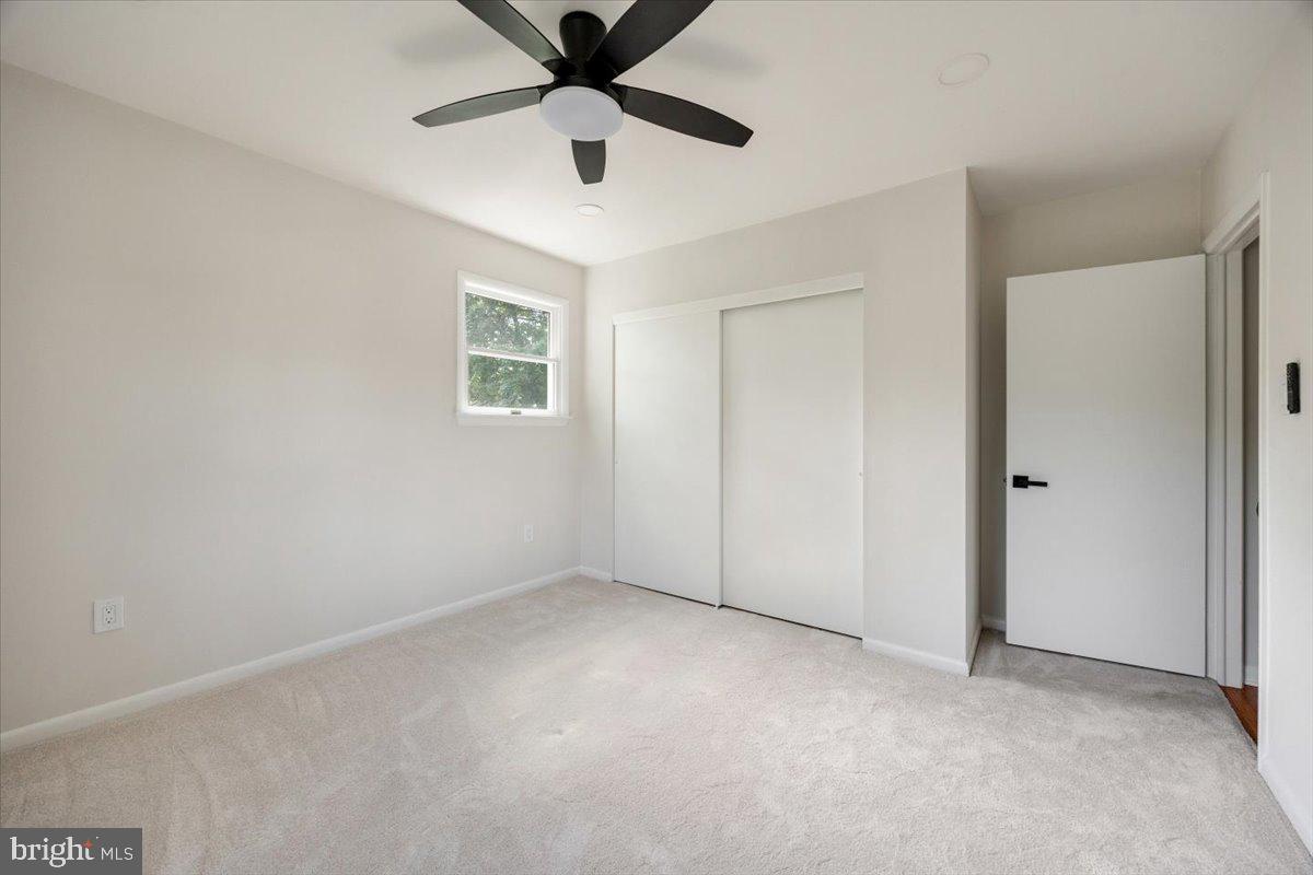 63 Baker Boulevard Marlton, NJ 08053 - Photo 23 of 38 an empty room with a window and a fan