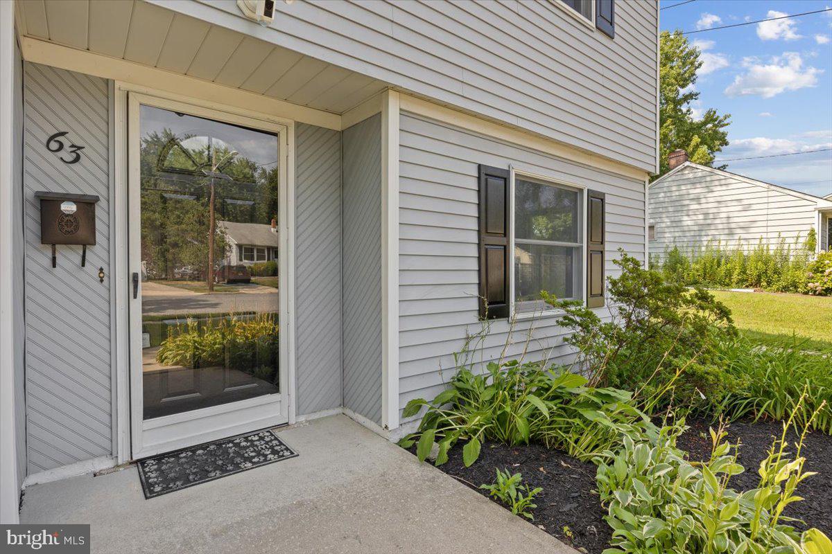 63 Baker Boulevard Marlton, NJ 08053 - Photo 3 of 38 a front view of a house with a yard