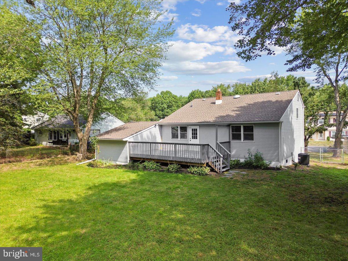 63 Baker Boulevard Marlton, NJ 08053 - Photo 33 of 38 a view of a house with a big yard and large trees