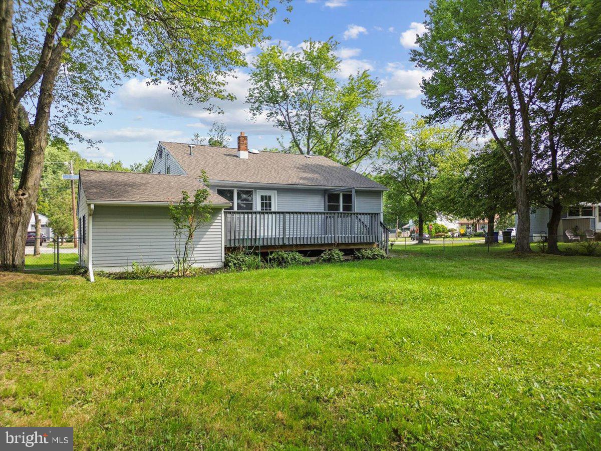 63 Baker Boulevard Marlton, NJ 08053 - Photo 34 of 38 a front view of a house with a garden and trees