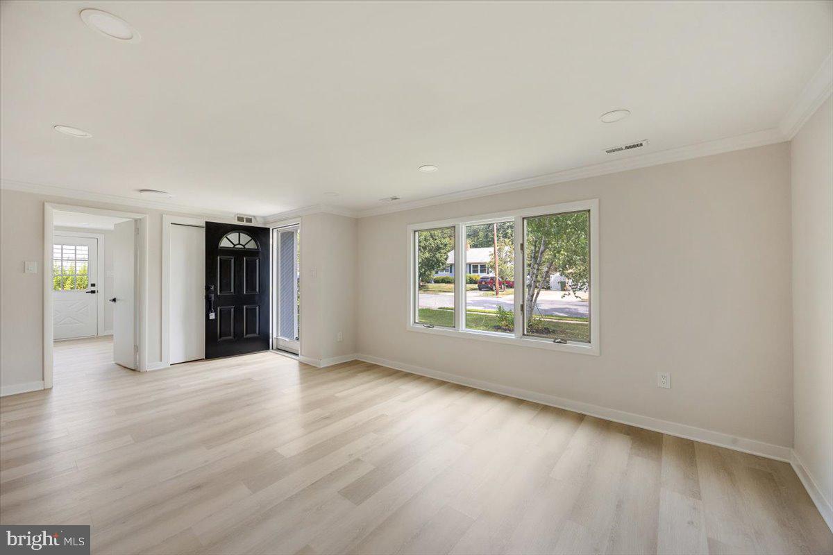 63 Baker Boulevard Marlton, NJ 08053 - Photo 6 of 38 an empty room with wooden floor and windows