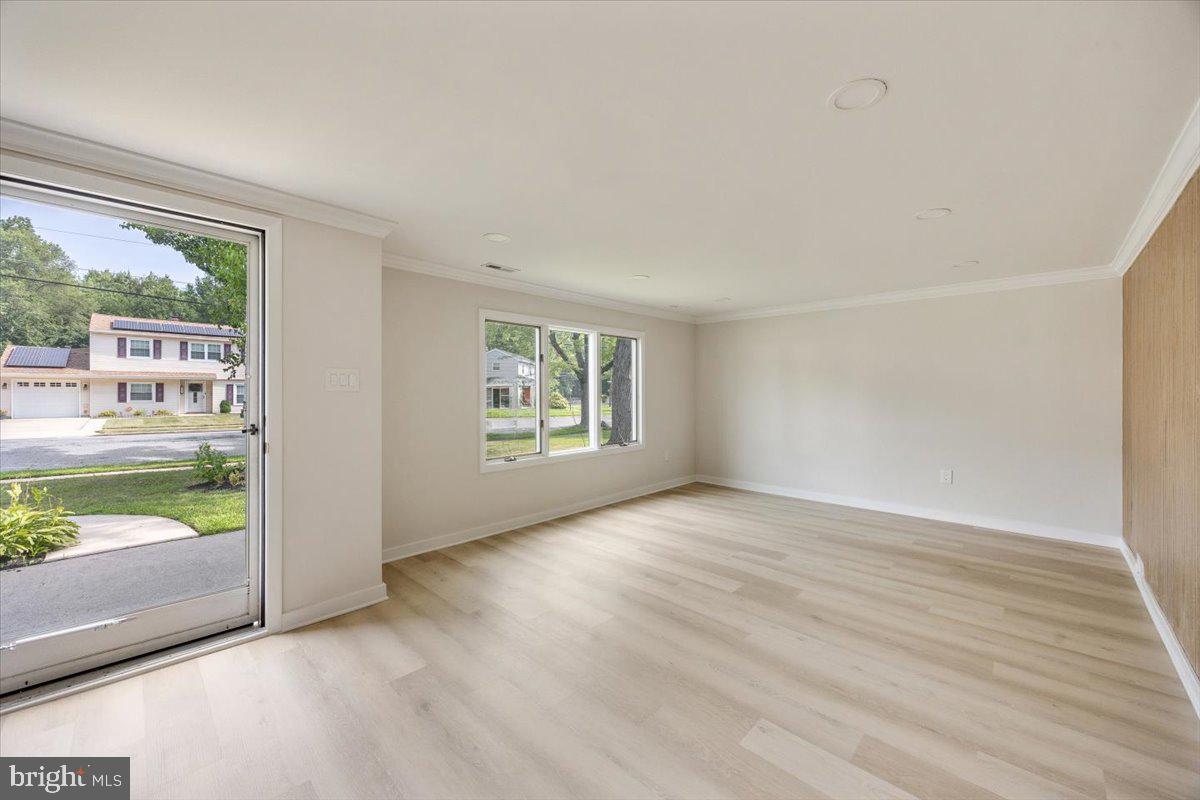 63 Baker Boulevard Marlton, NJ 08053 - Photo 8 of 38 an empty room with wooden floor and windows