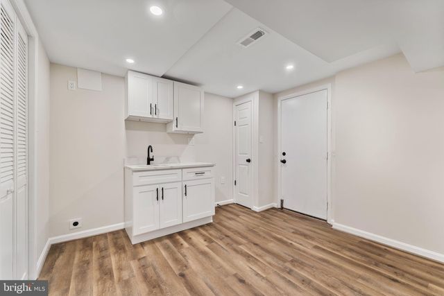 a view of kitchen with wooden floor