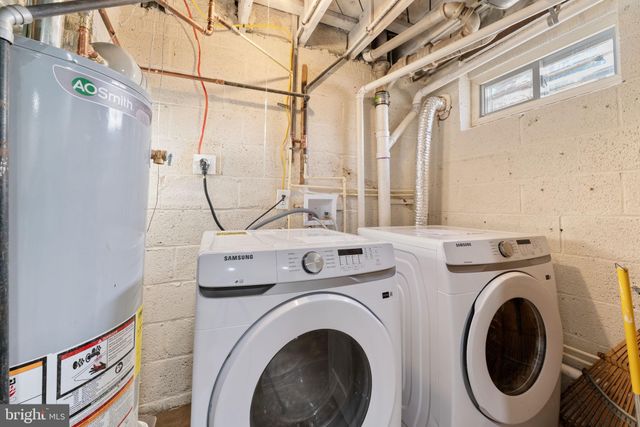 a view of a hallway with washer and dryer