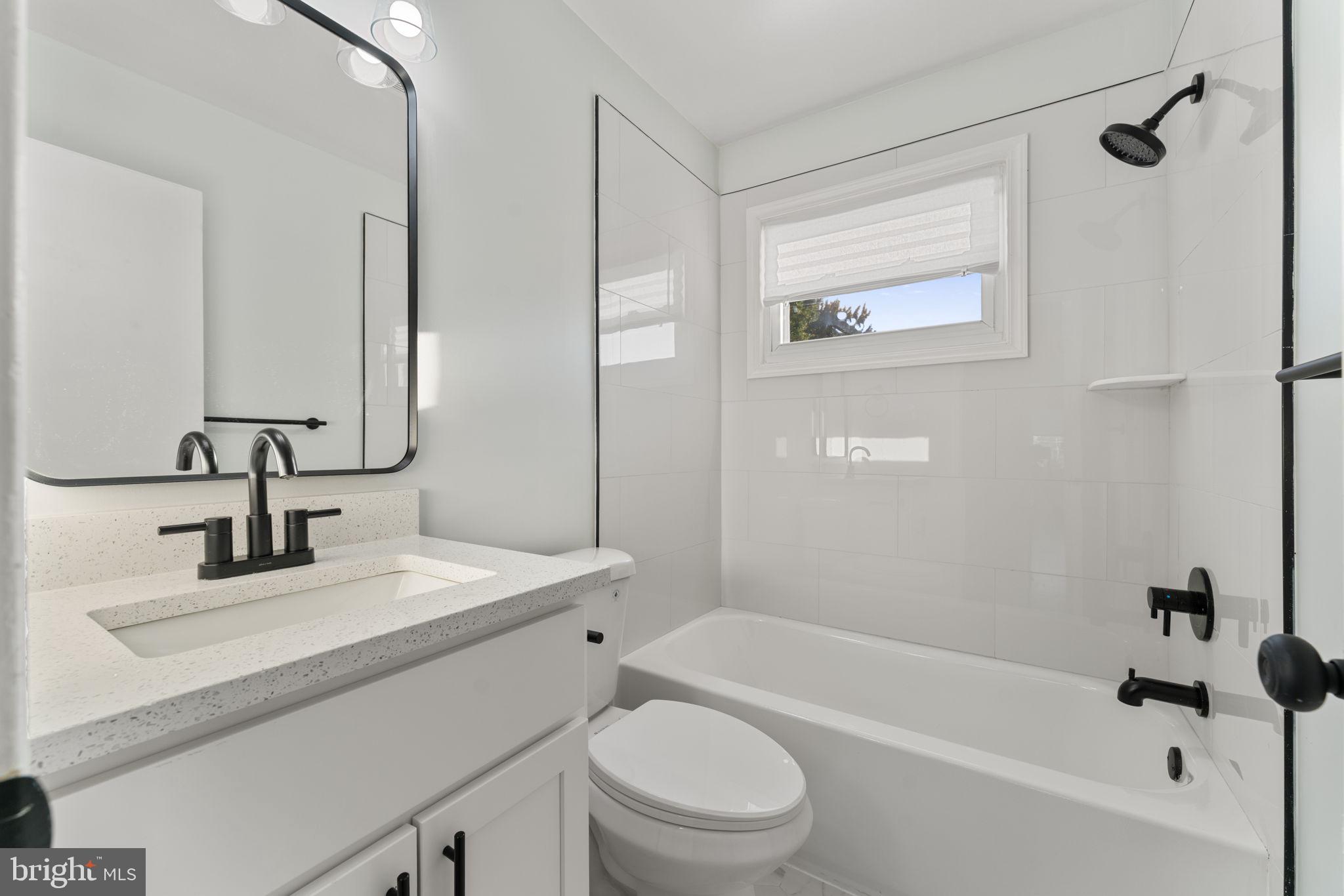 2605 Keith Street Temple Hills, MD 20748 - Photo 14 of 20 a bathroom with a sink a toilet and shower