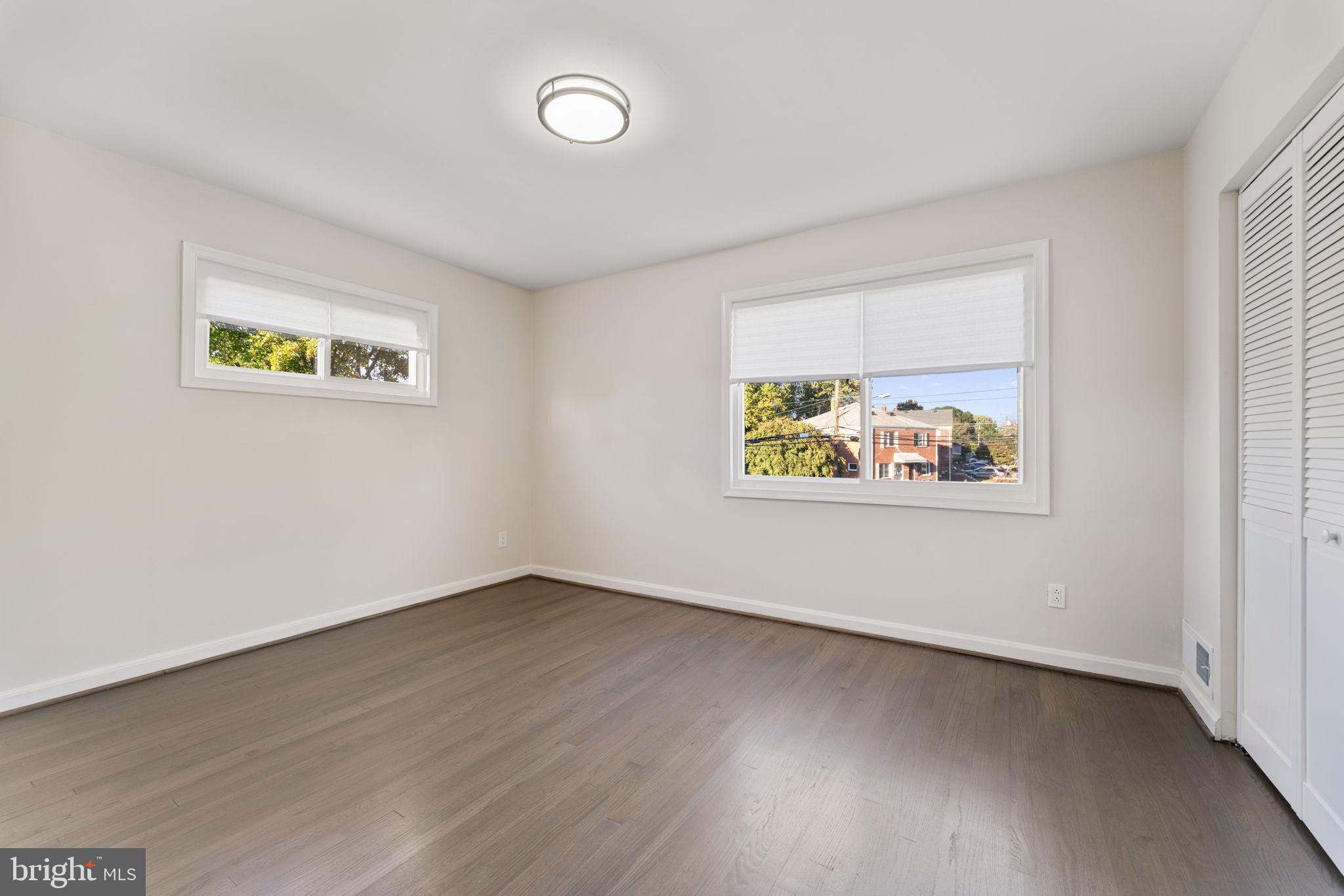 2605 Keith Street Temple Hills, MD 20748 - Photo 17 of 20 an empty room with wooden floor and window