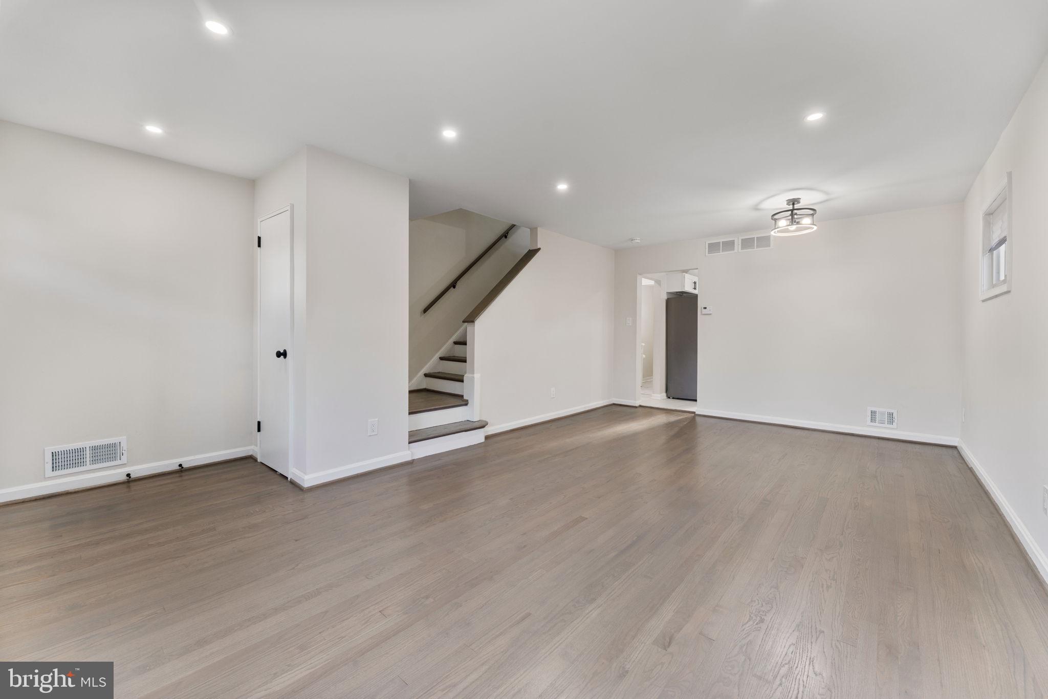 2605 Keith Street Temple Hills, MD 20748 - Photo 3 of 20 an empty room with wooden floor and entryway